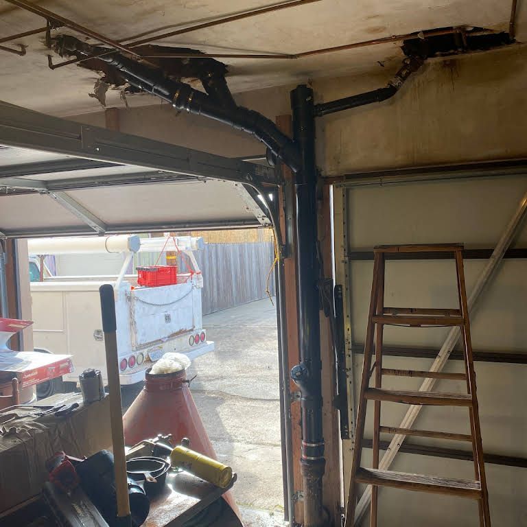 A garage with plumbing pipes