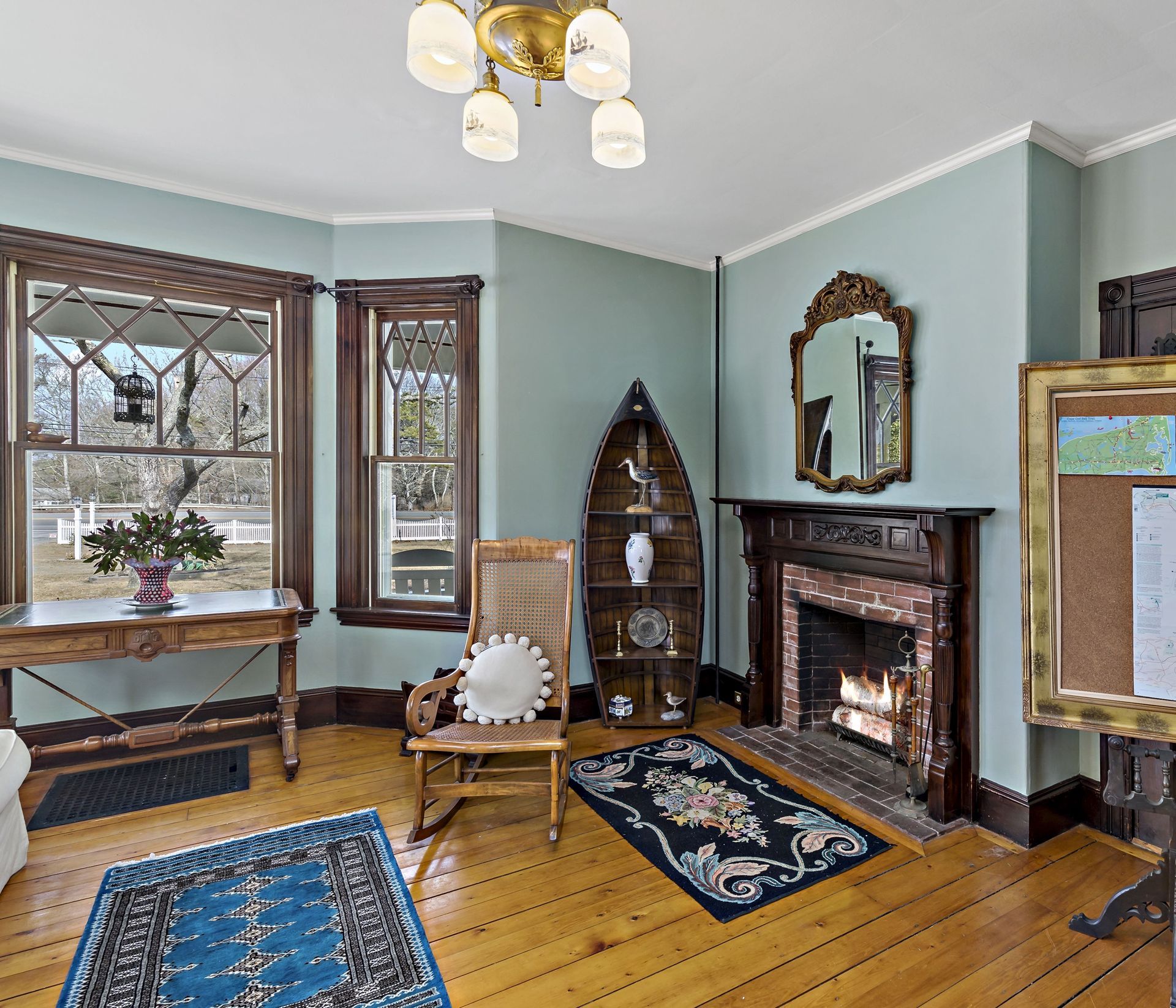 A living room with a fireplace and a chair
