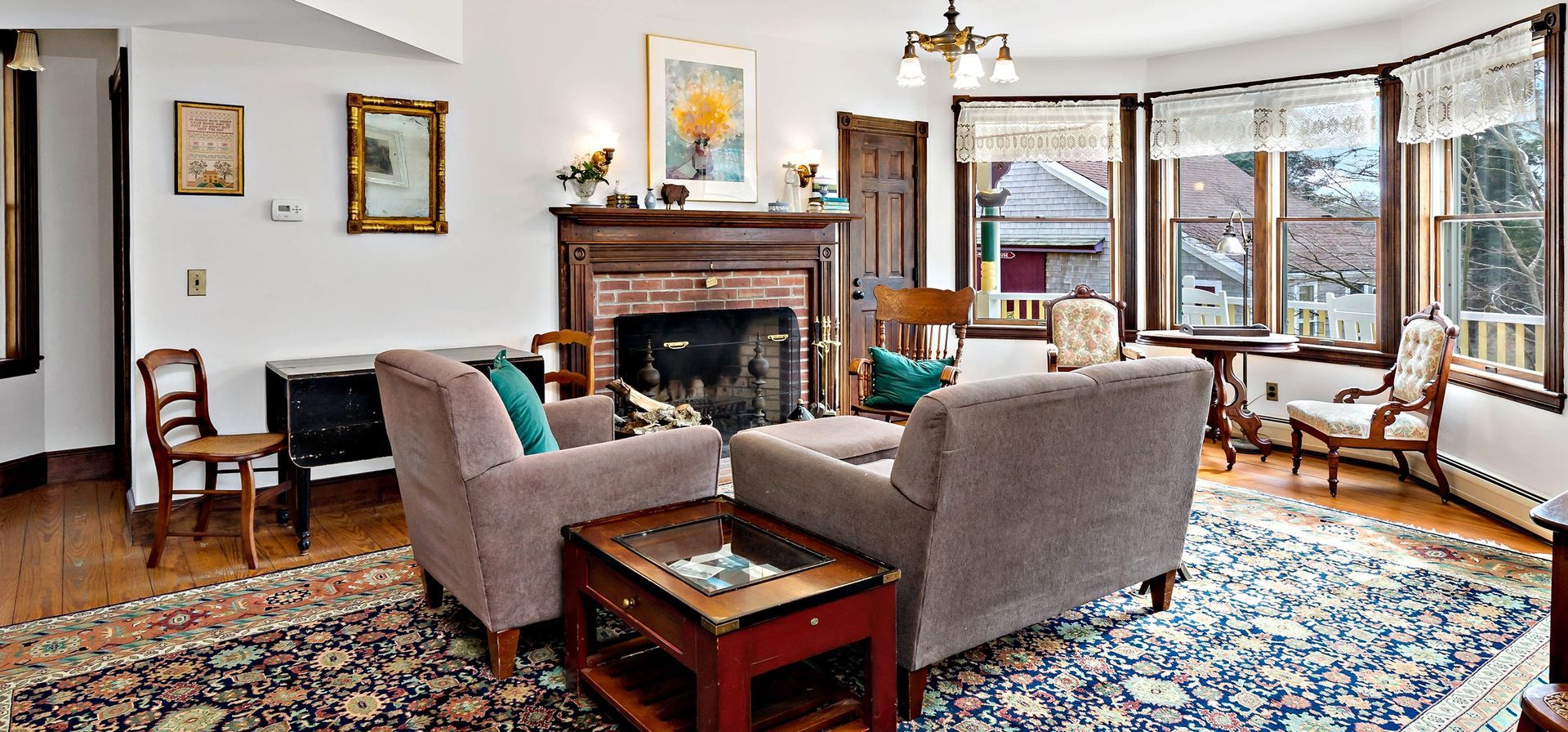 A living room filled with furniture and a fireplace