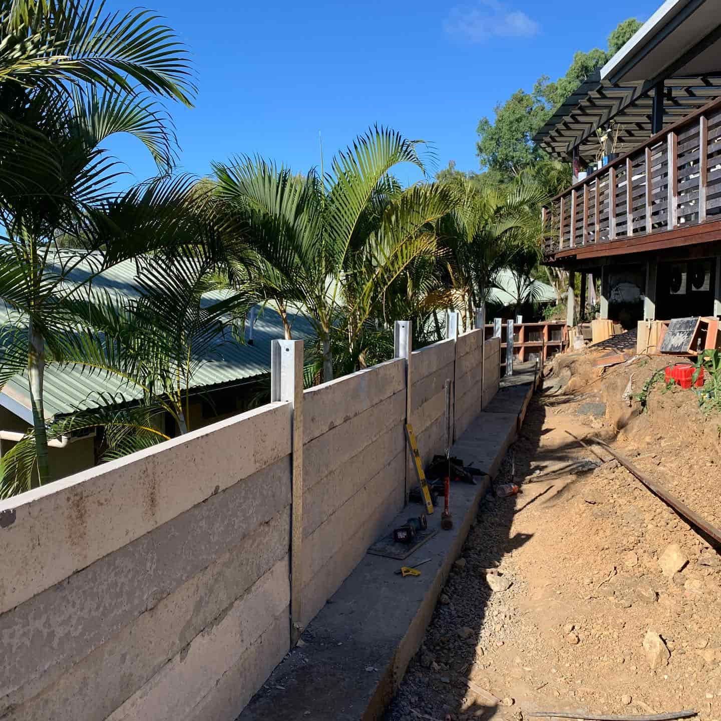 A Concrete Fence is Being Built in Front of a House — Coral Coast Building & Management in Airlie Beach, QLD