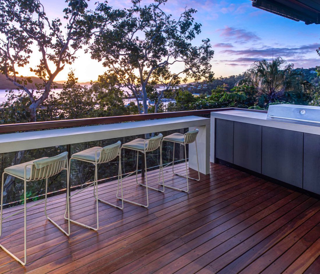 A Group of Men Are Standing on Top of a Dirt Hill — Coral Coast Building & Management in Cannon Valley, QLD