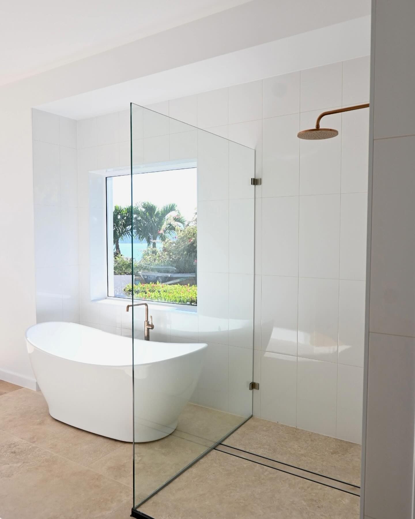 A Bathroom With a Bathtub and a Walk in Shower — Coral Coast Building & Management in Cannon Valley, QLD