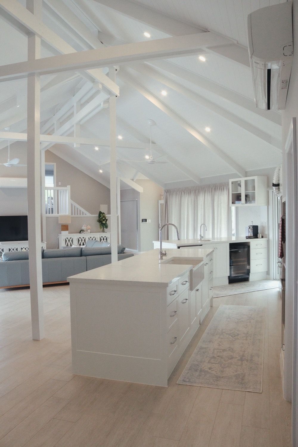 A Kitchen With a Large Island in the Middle of It — Coral Coast Building & Management in Cannon Valley, QLD