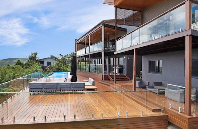 A Large House With a Large Deck and a Swimming Pool — Coral Coast Building & Management in Cannon Valley, QLD