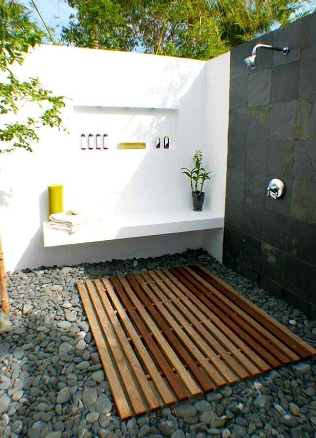 A Shower With a Wooden Mat in Front of It — Coral Coast Building & Management in Cannon Valley, QLD