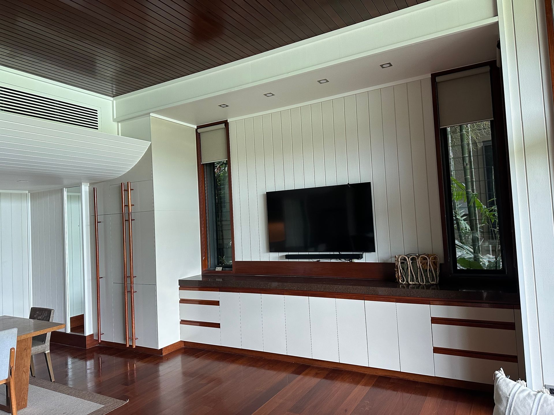A Large House With a White Roof is Sitting on Top of a Hill — Coral Coast Building & Management in Cannon Valley, QLD