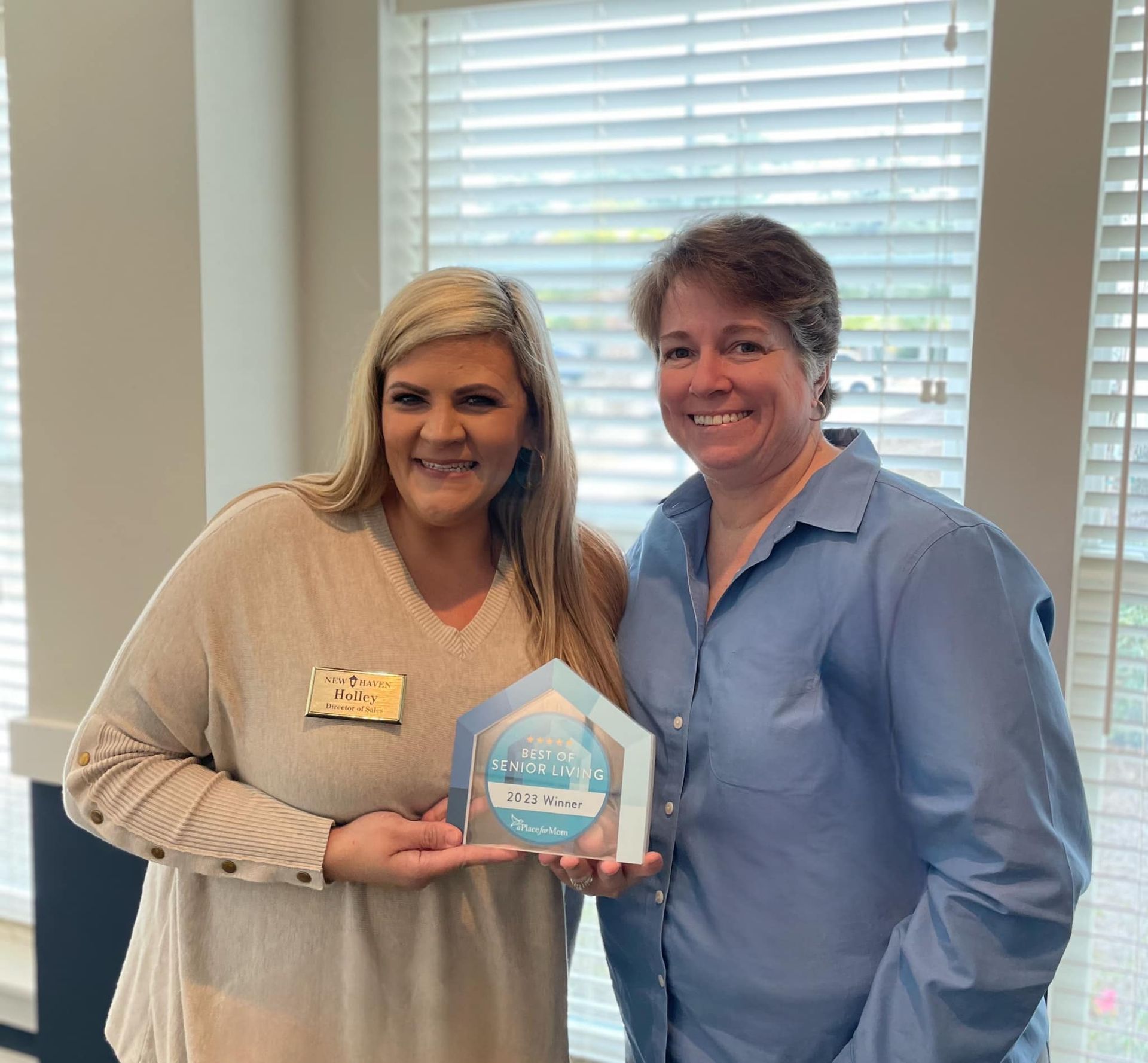 New Haven at Little River Director of Sales, Holley Sellers (left) and Executive Director Kathleen Douglass hold the 2023 Best in Senior Living award.