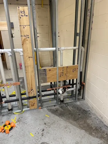 A room with a metal frame and pipes in it.