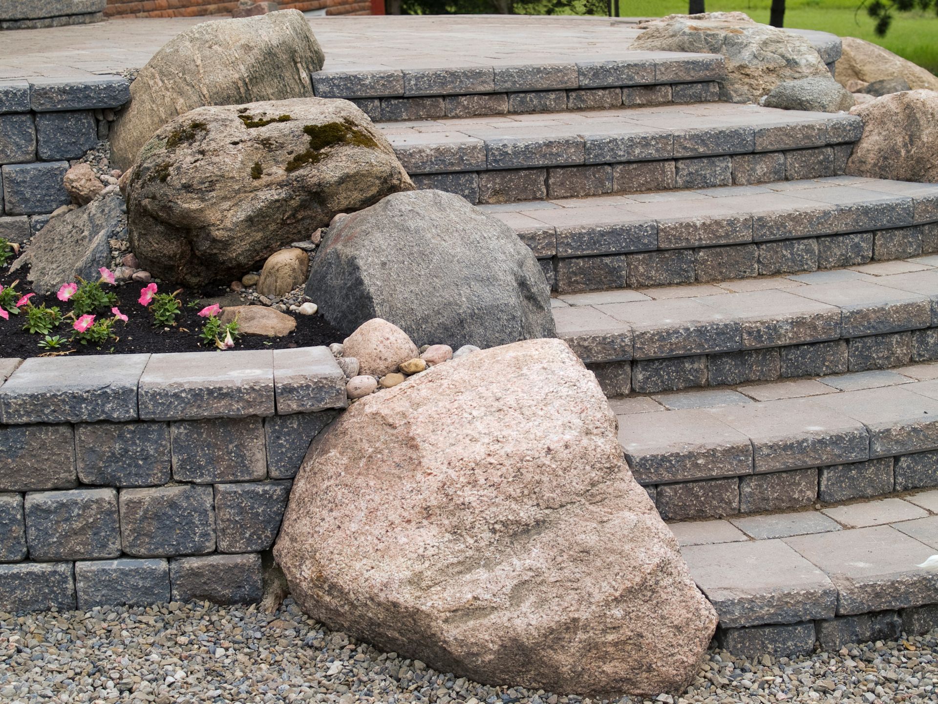 A set of stairs surrounded by rocks and gravel