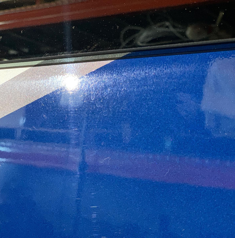 A blue surface with a red white and blue stripe on it