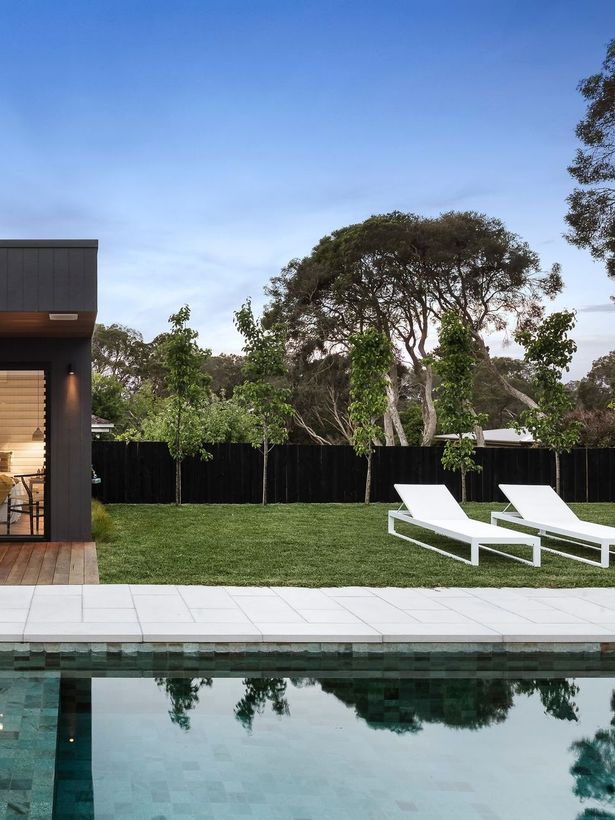 modern pool in backyard of residential home