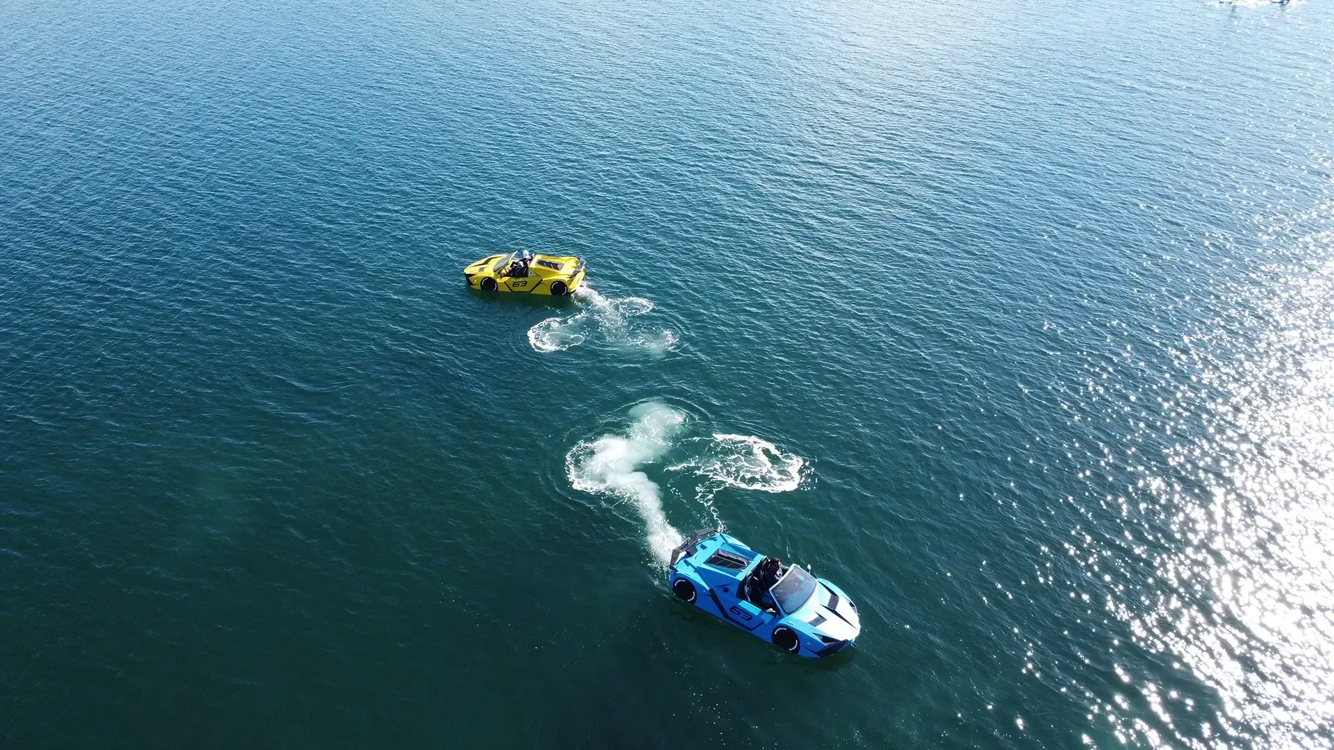 A group of boats are floating on top of a body of water.