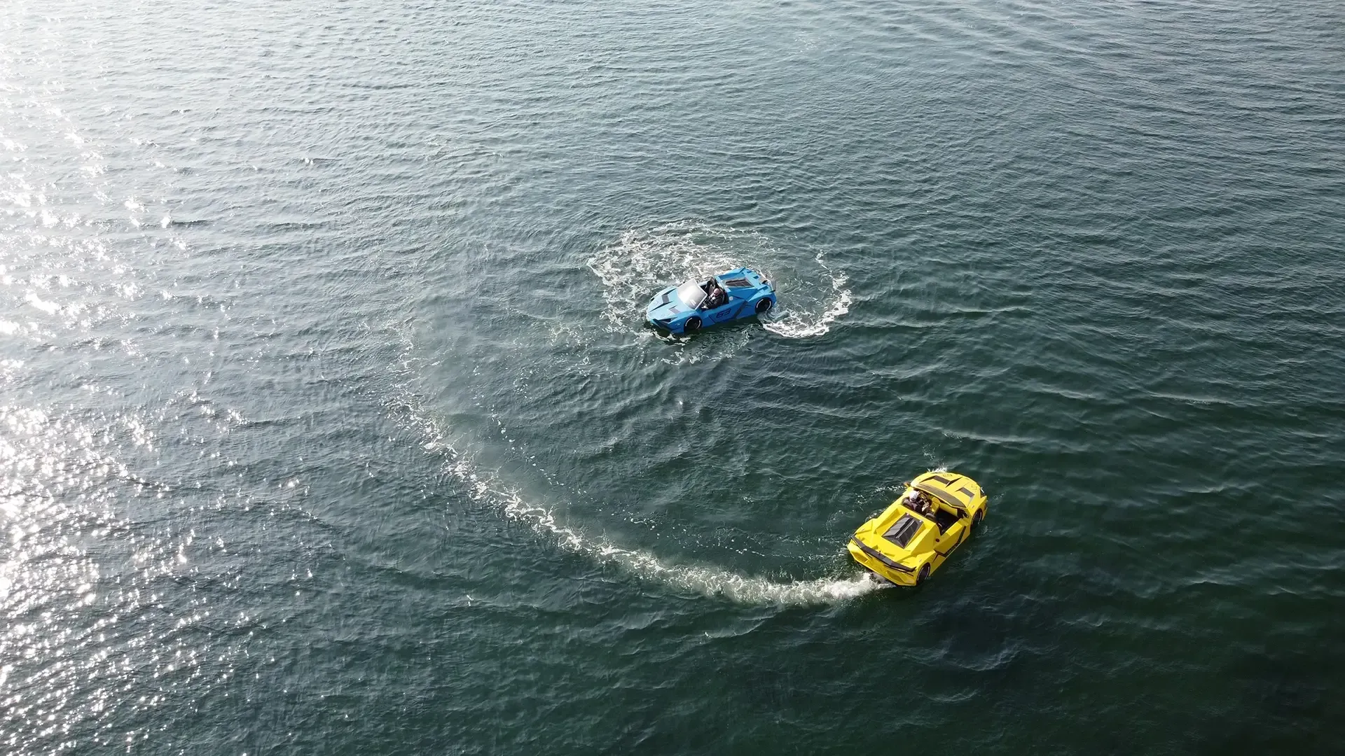 A couple of boats are floating on top of a body of water.