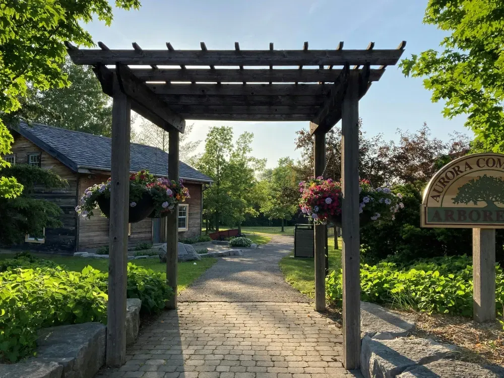A wooden pergola with a sign in Lindenhurst, IL
