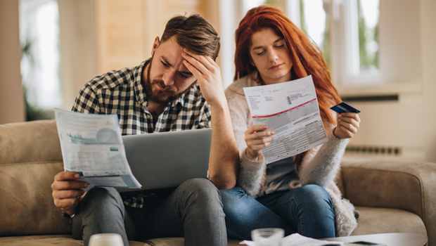 Couple looking at a high water bill