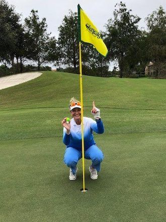 Doris Muscarella Holding Golf Ball - Fort Lauderdale, FL - Menéndez Law Firm
