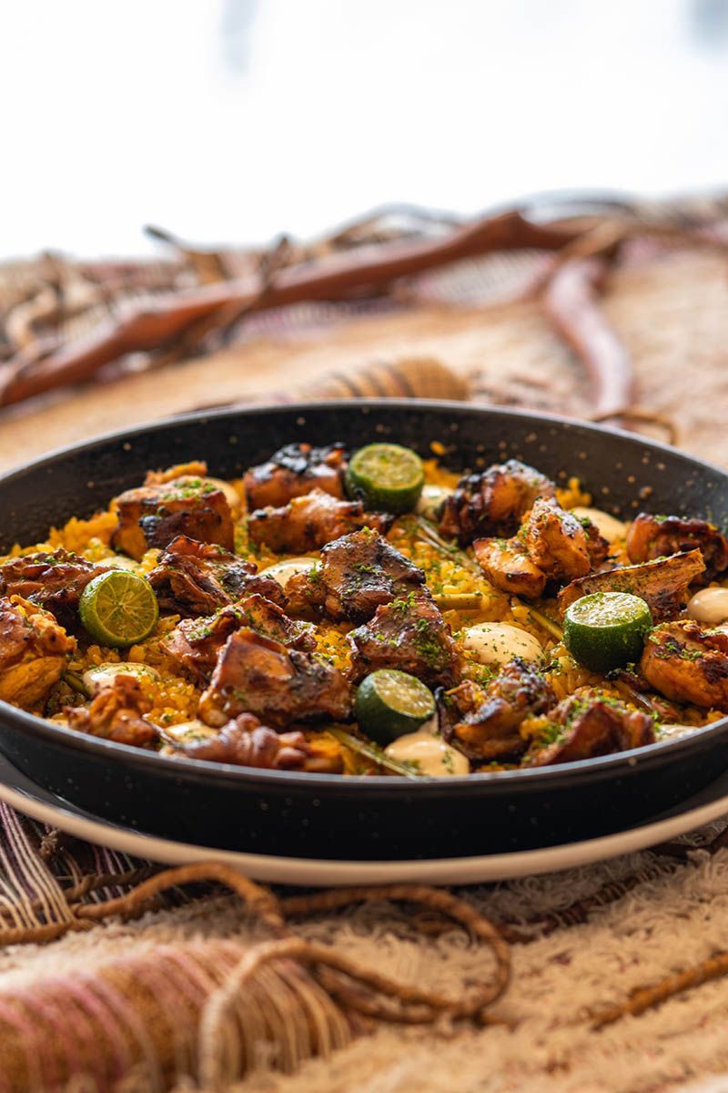 La Cocina grilled meat and saffron rice dish with lime at Costa Solana Resort