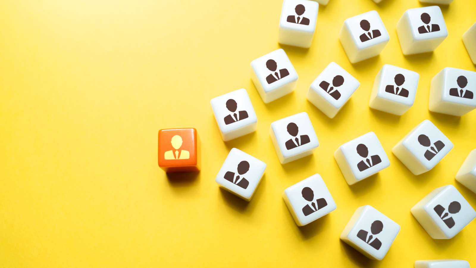 A group of dice with people on them on a yellow background.