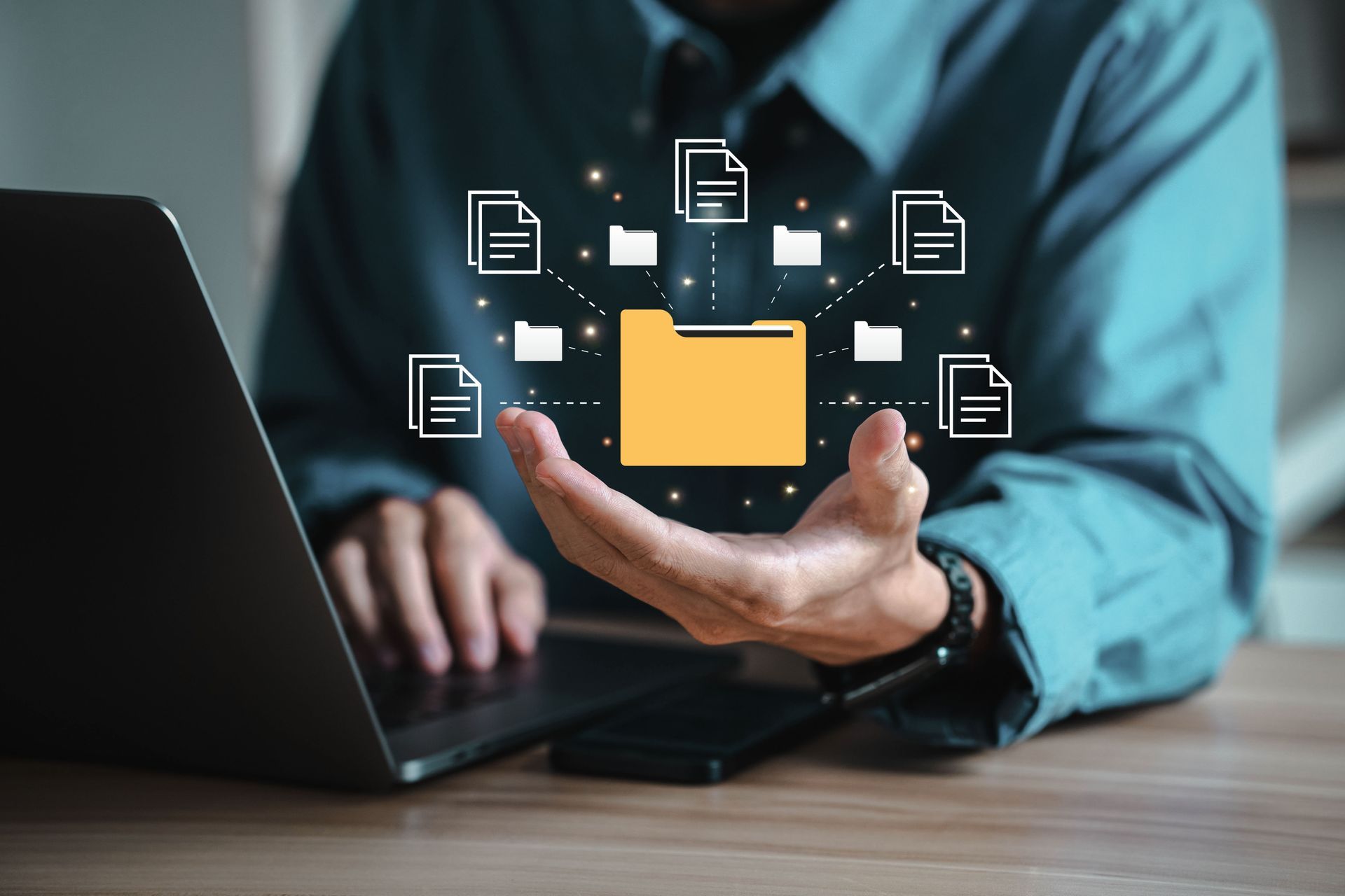 An individual Sitting at a Laptop with Hand Upturned showing a digital document repository in SharePoint
