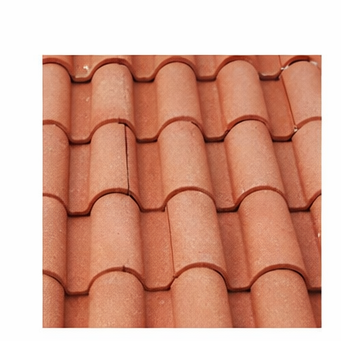A repeating pattern of terracotta-colored, curved roof tiles arranged in rows.