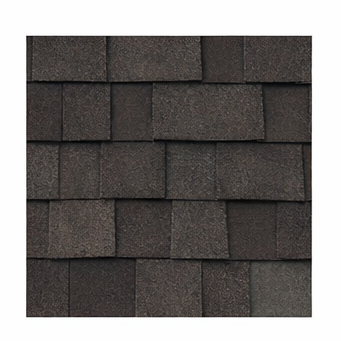 A close-up view of dark brown architectural asphalt shingles installed in an overlapping pattern.