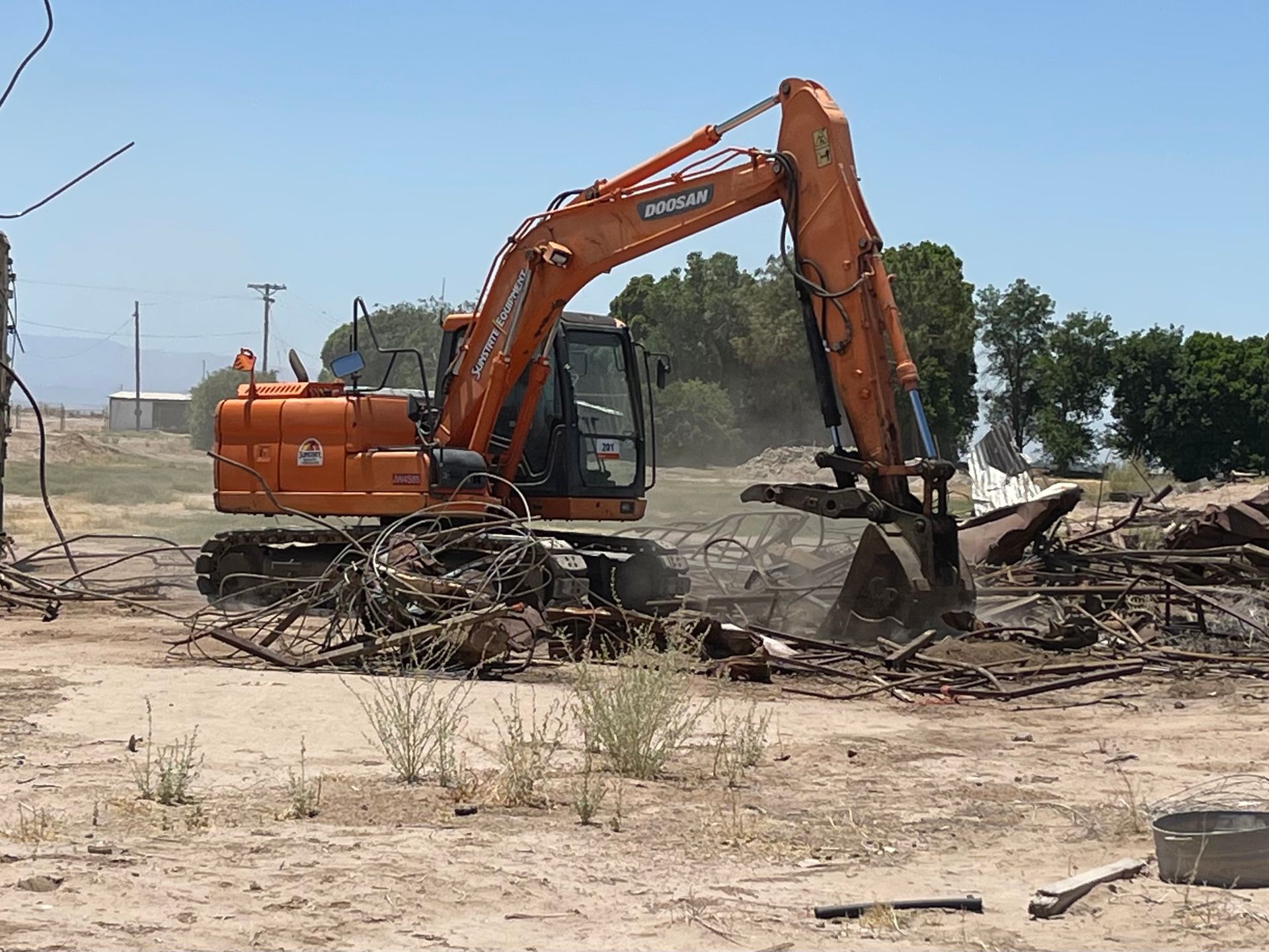 A doosan excavator is working on a construction site