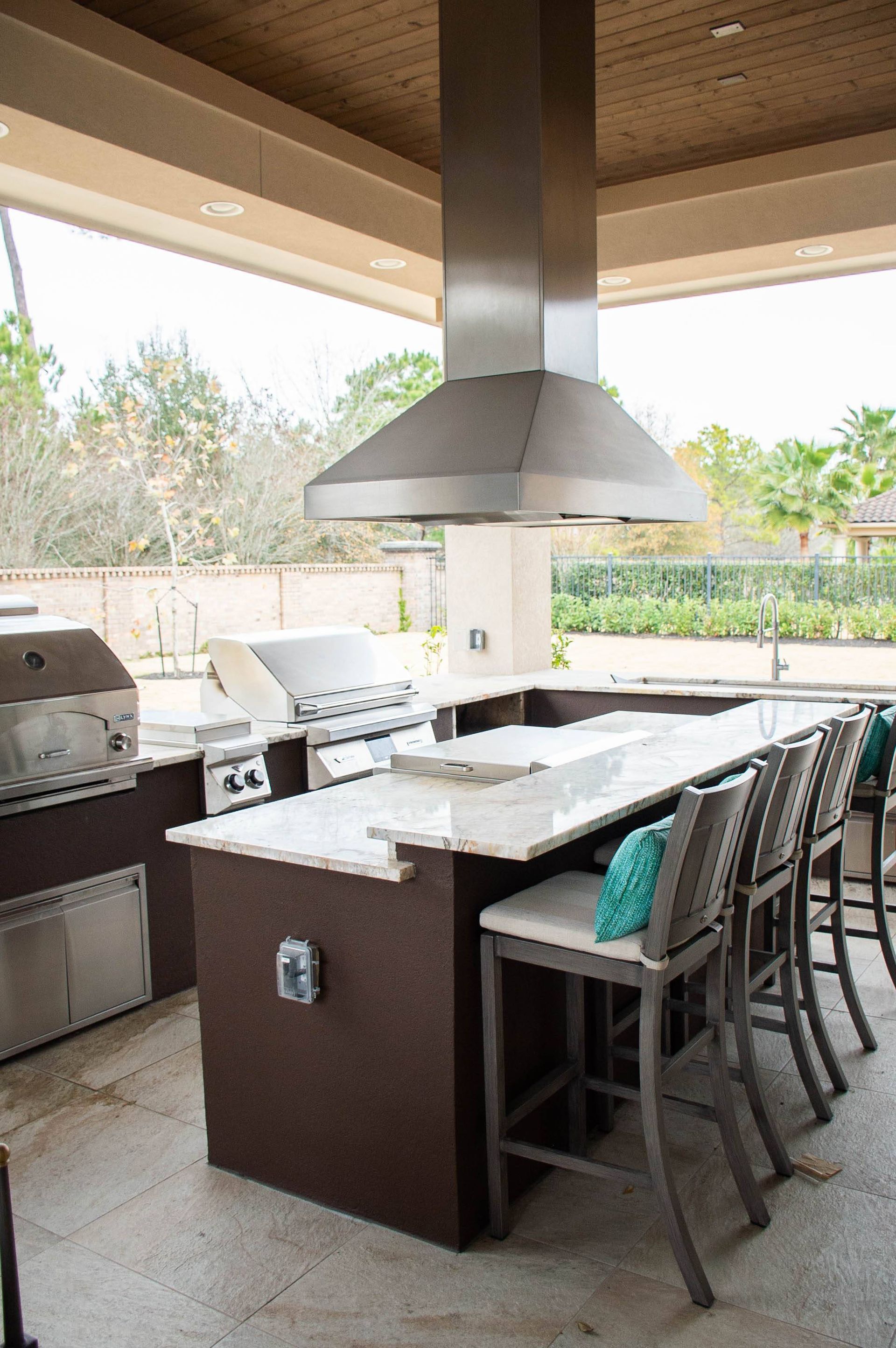 There is a large island in the middle of the kitchen.