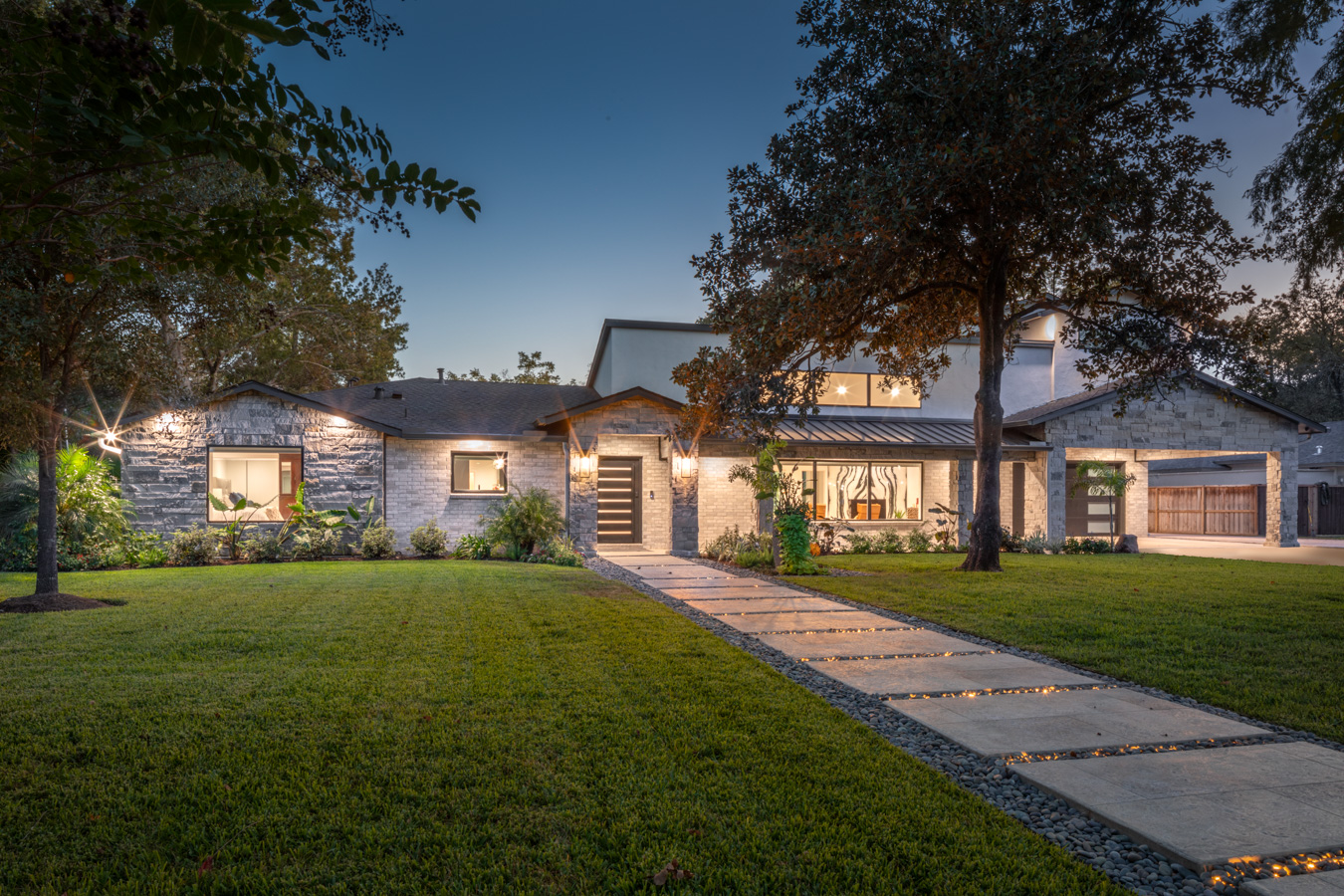 A large house with a walkway leading to it