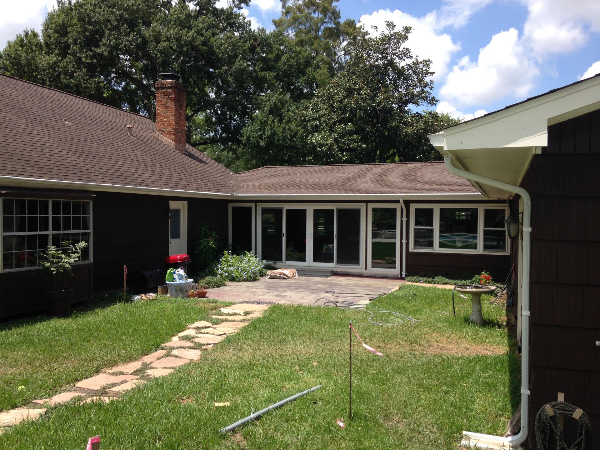 A house with a lot of windows and a walkway leading to it