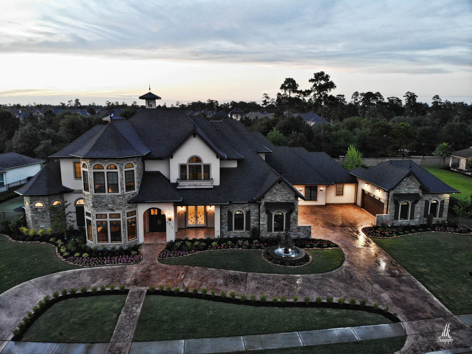 An aerial view of a large house with a lot of windows