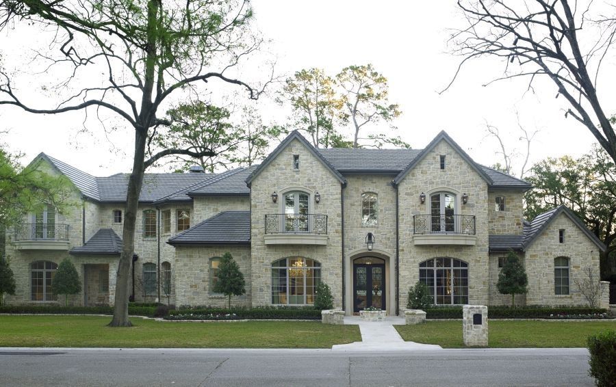 A large house with a lot of windows and balconies