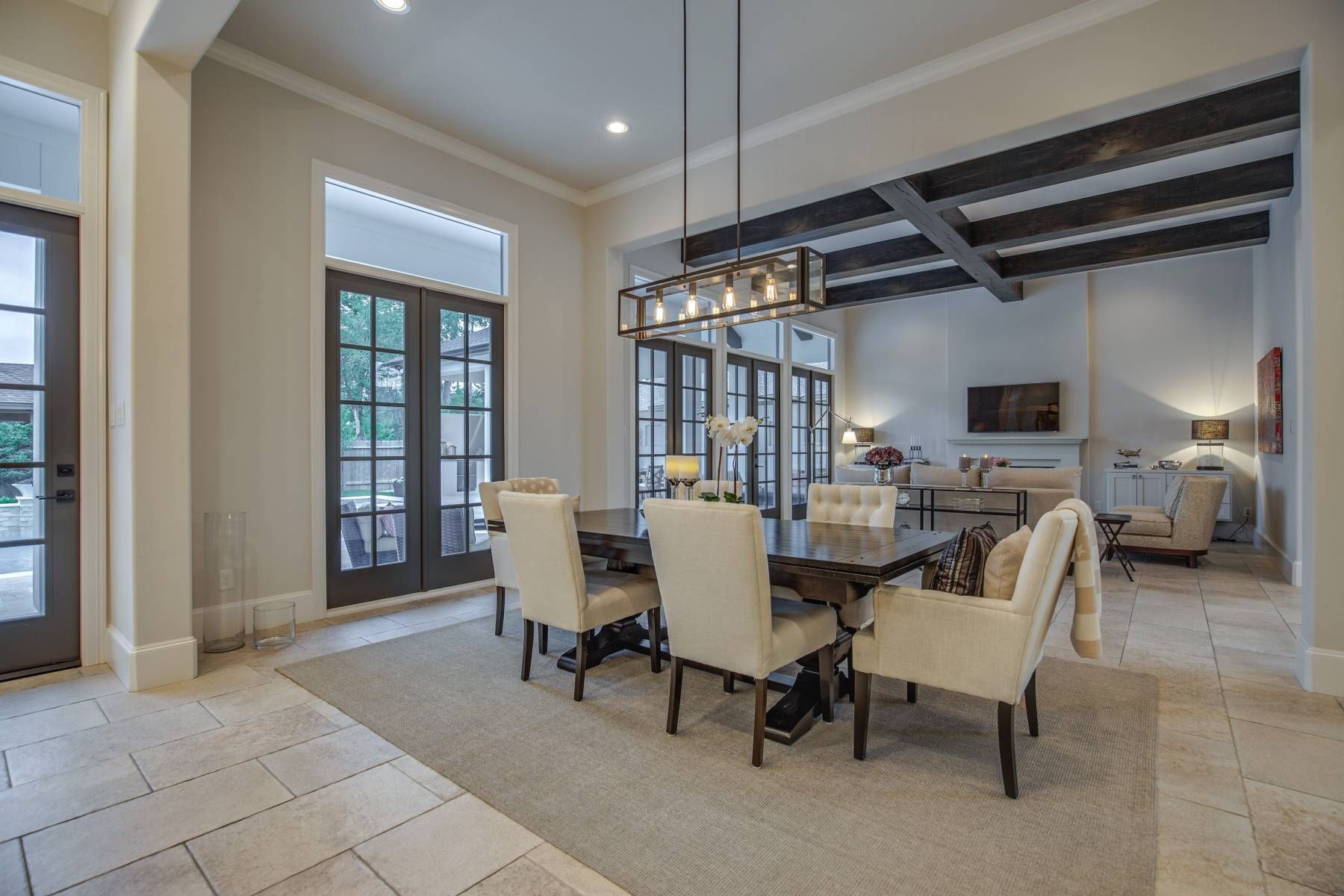 There is a dining room table and chairs in the middle of the room.