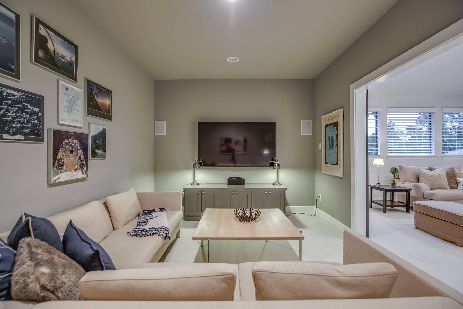 A living room with a couch , coffee table , and television.