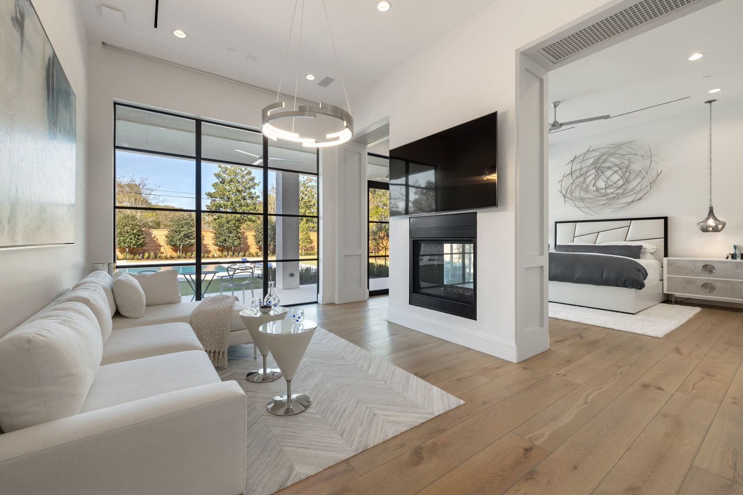 A living room with a fireplace and a flat screen tv.