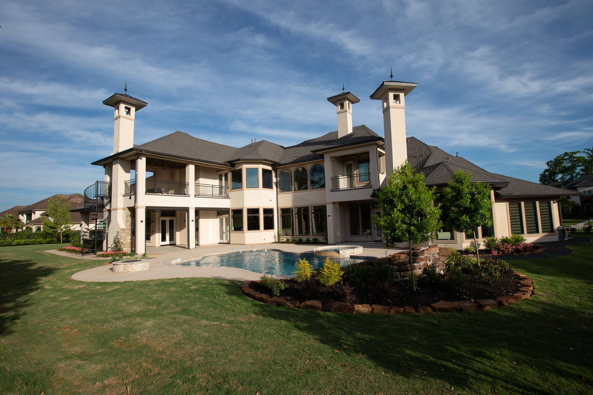 A large house with a pool in the backyard