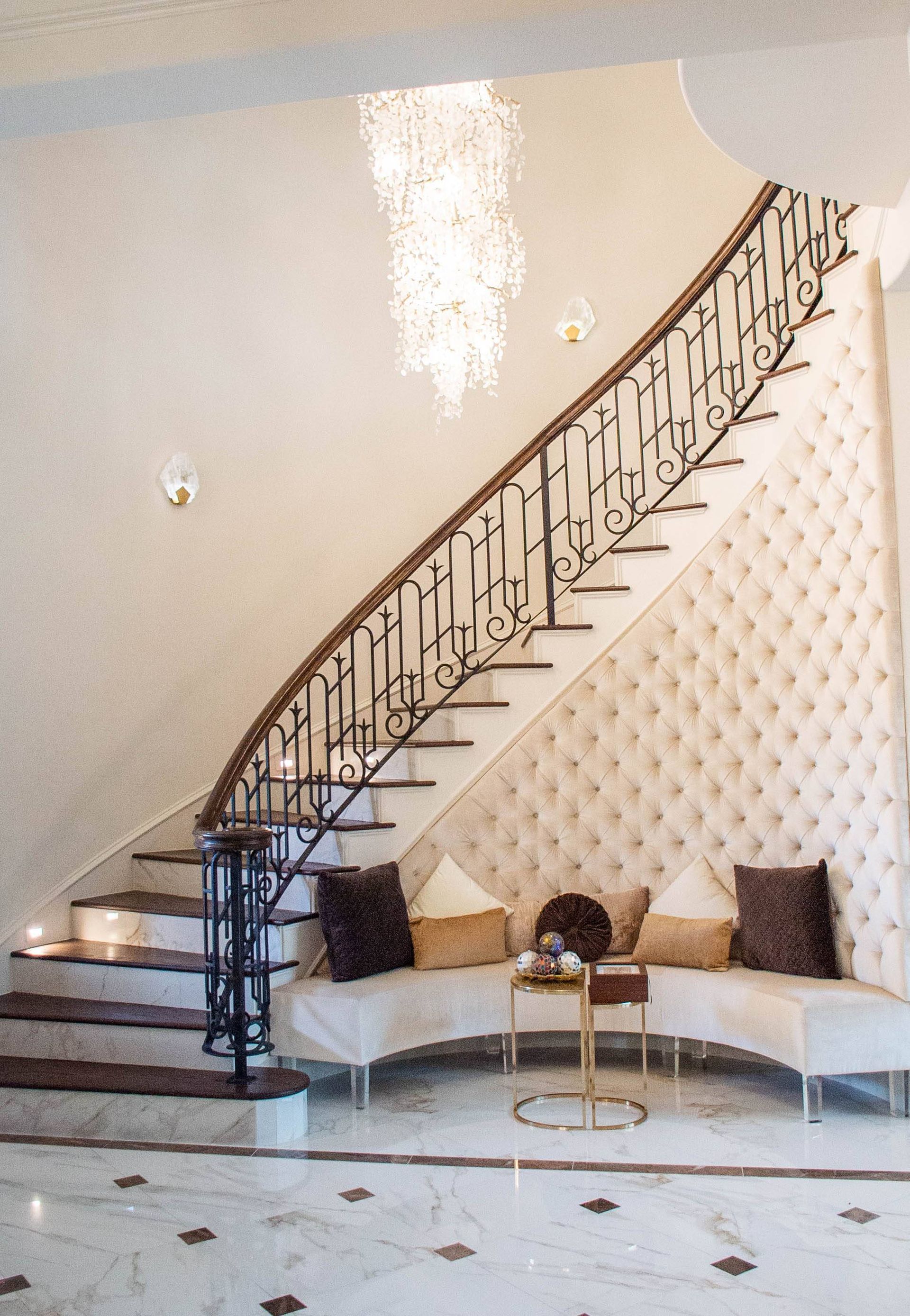 A living room with a staircase and a couch