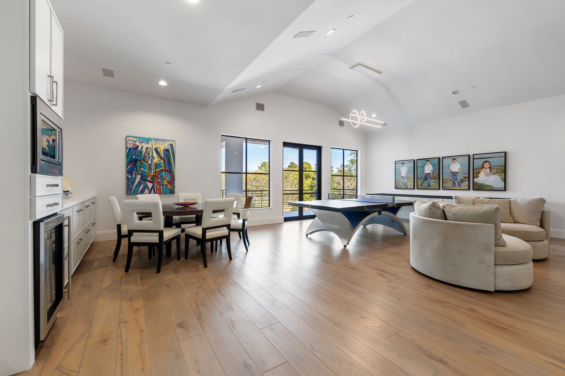 There is a pool table in the middle of the room.