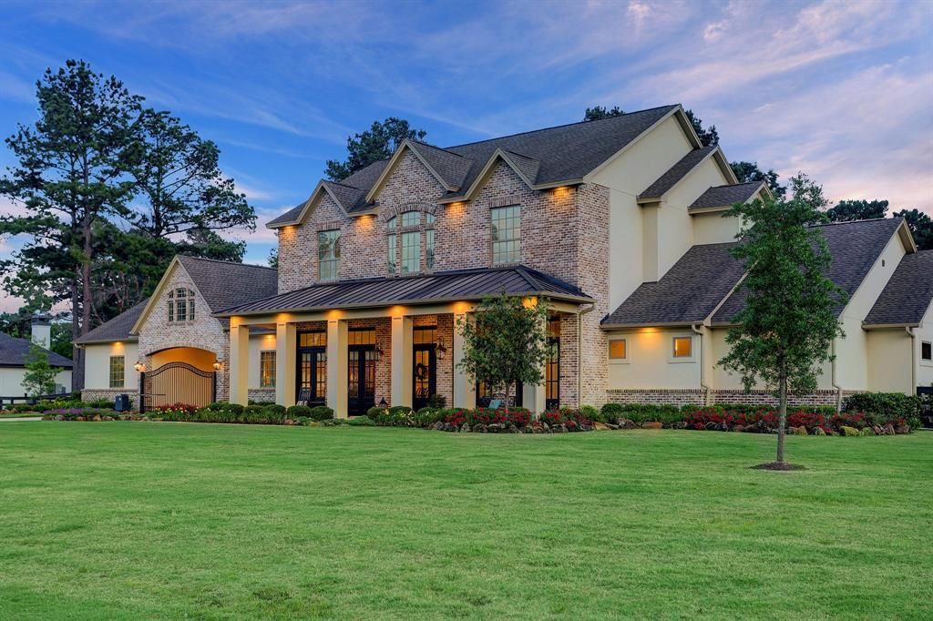 A large house with a large lawn in front of it