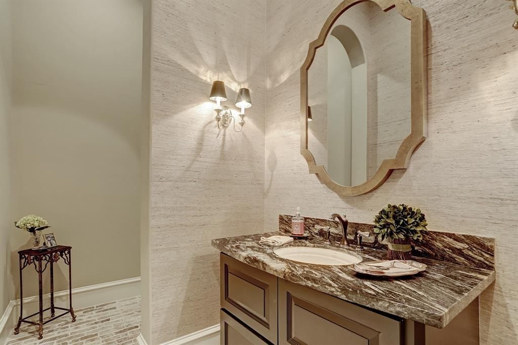 A bathroom with two sinks and a mirror