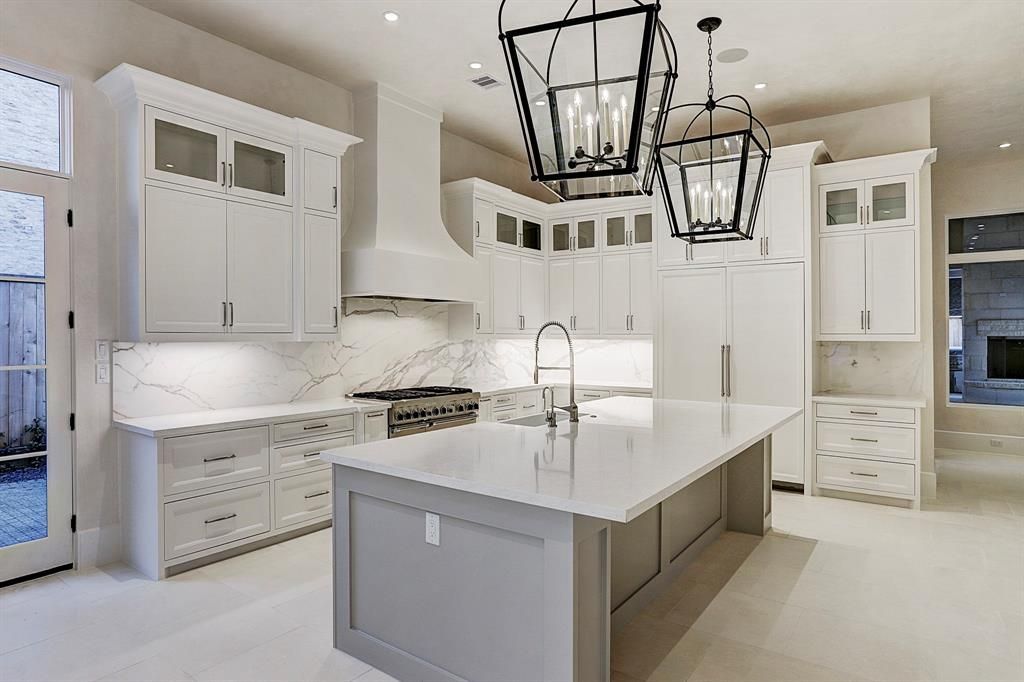 There is a large island in the middle of the kitchen.