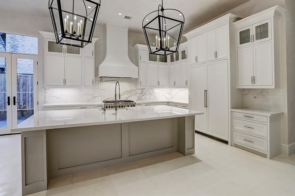 There is a large island in the middle of the kitchen.