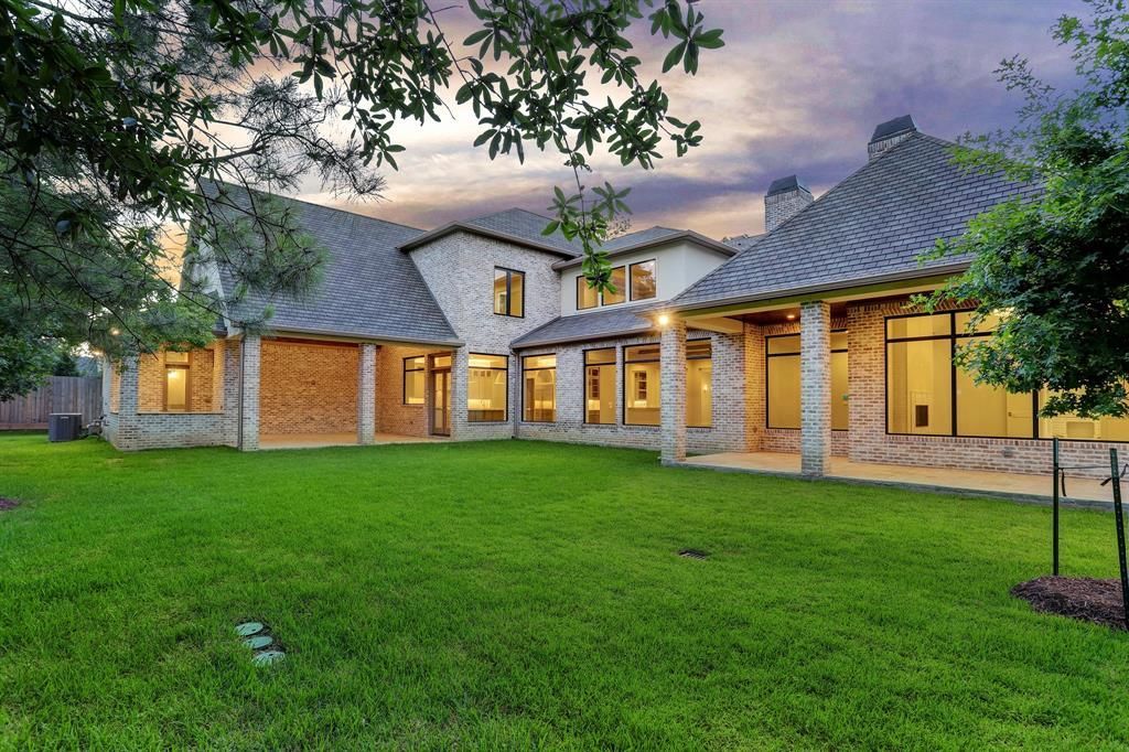 A large house with a large lawn in front of it