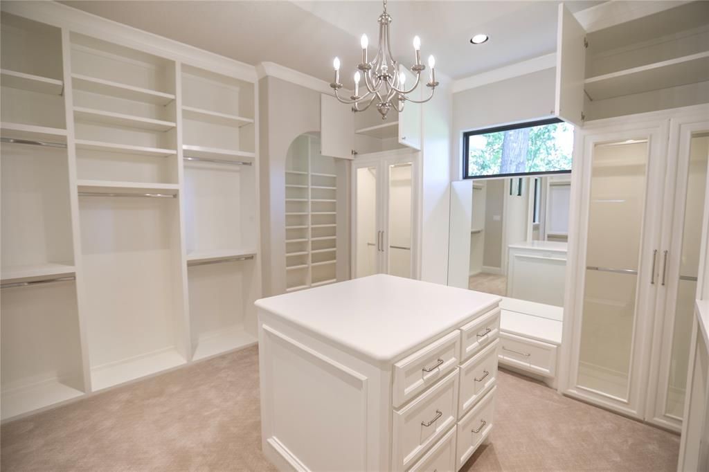 There is a large island in the middle of the closet.