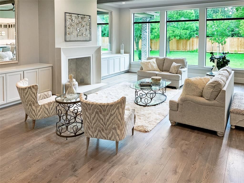 A living room filled with furniture and a fireplace.