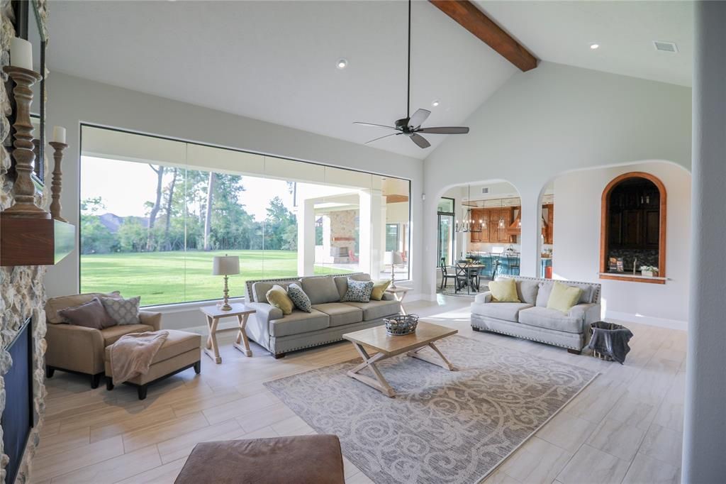 A living room filled with furniture and a fireplace.