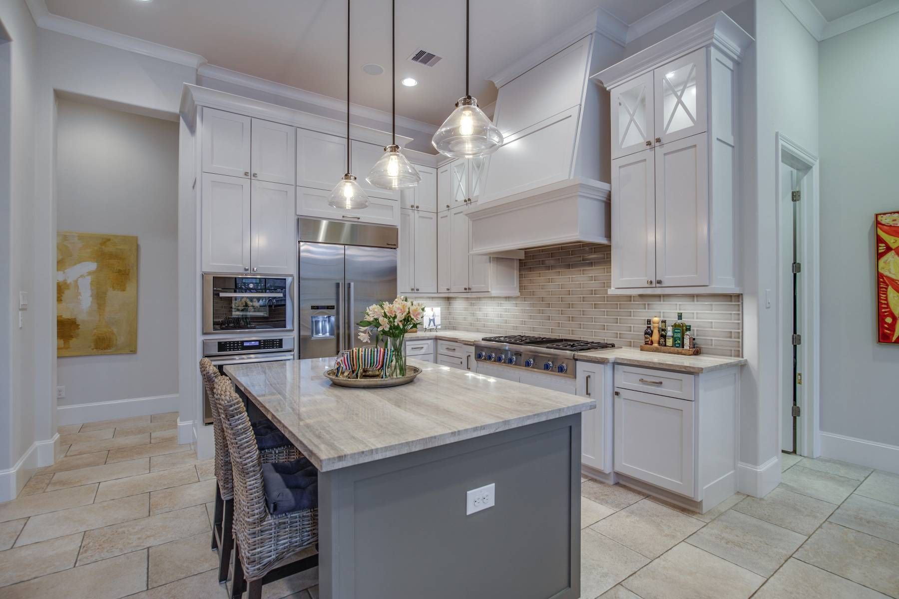 There is a large island in the middle of the kitchen.