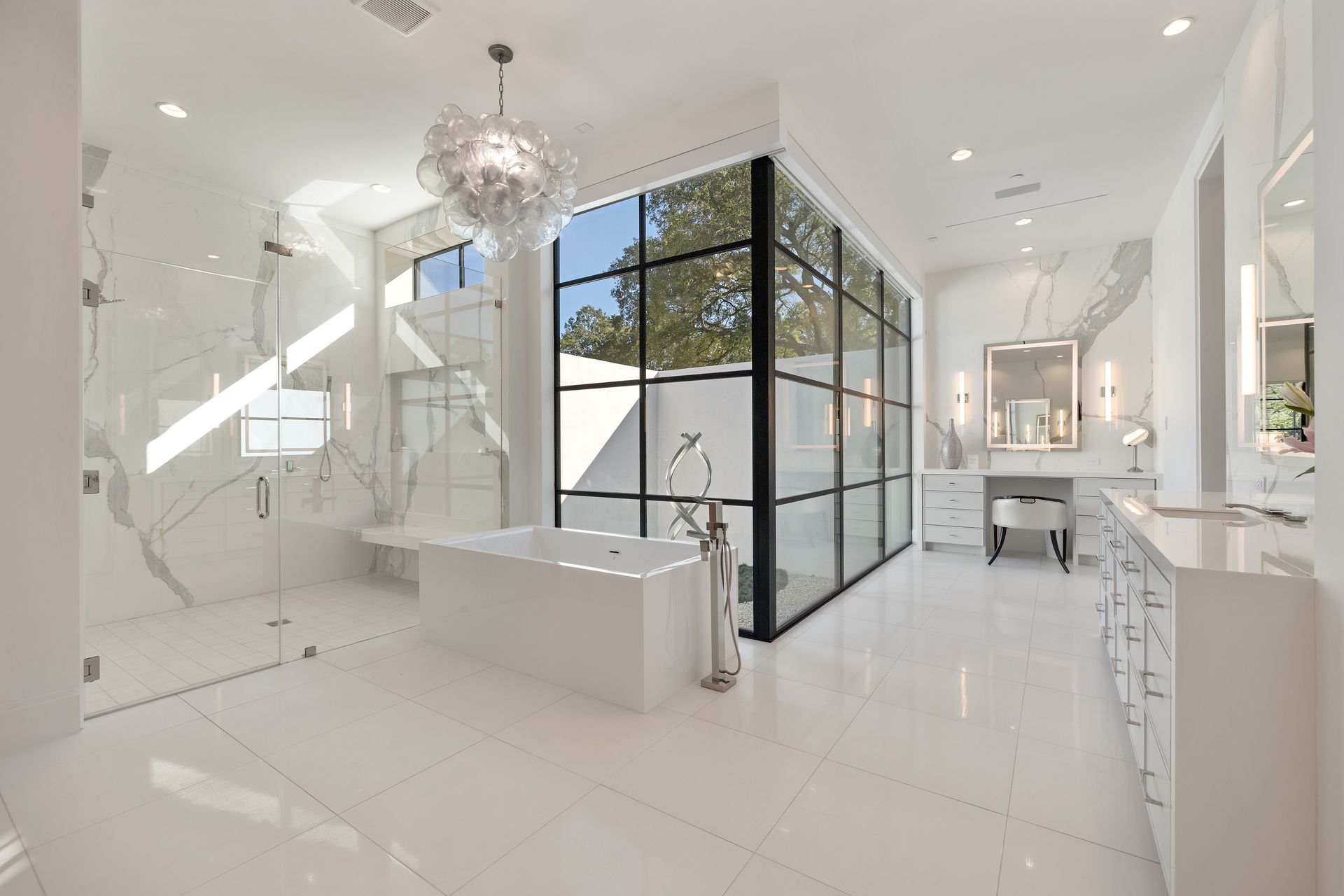 A bathroom with a bathtub and a walk in shower.