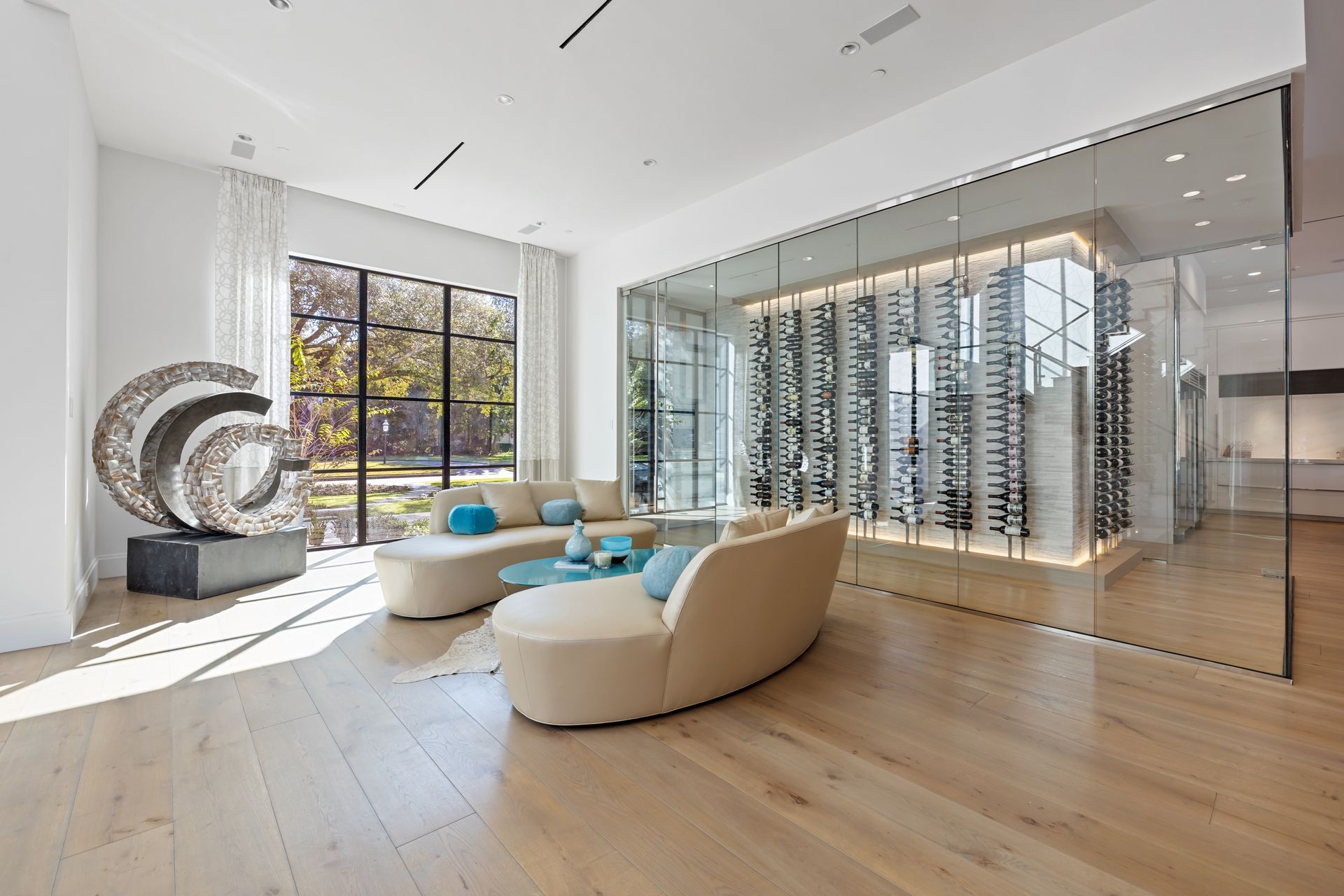 A living room filled with furniture and a wine cellar.