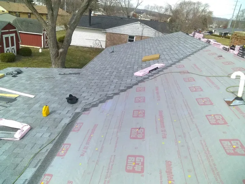 Residential roof installation in Hamilton OH - Haubner Construction hard at work