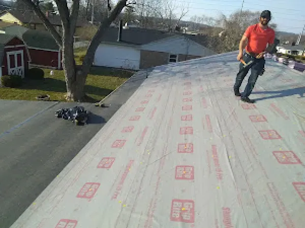 A roof installation in Hamilton, OH - Haubner Construction hard at work